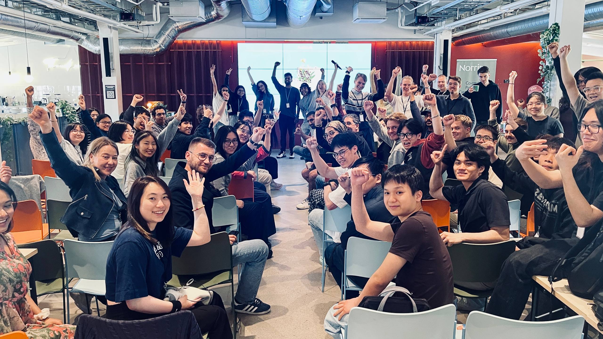 AaltoAI community cheering together at an event